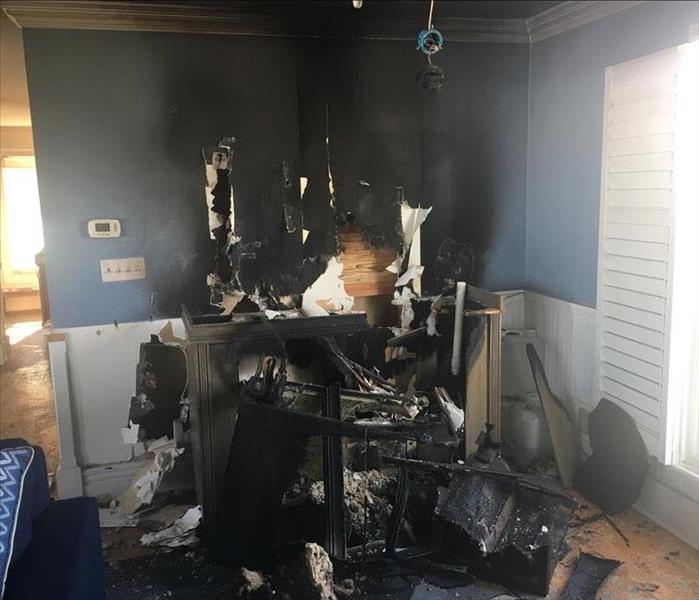 Fire damaged wall and desk