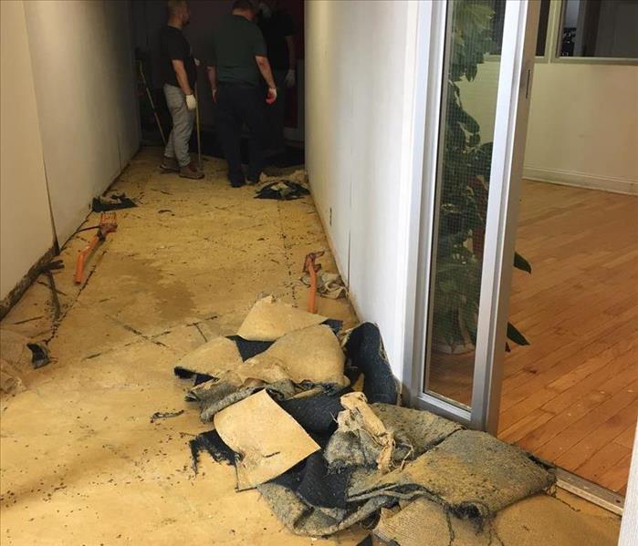 exposed damaged floor in hallway 